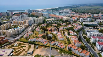 an aerial view of a city with buildings at 1 BDR Vilamoura Escape W Patio by LovelyStay in Quarteira