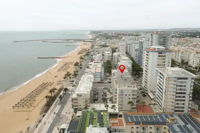 an aerial view of a beach with a red marker at Horizonte - Sea view by HD PROPERTIES in Quarteira
