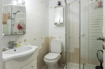 a bathroom with a toilet and a sink and a shower at Horizonte - Sea view by HD PROPERTIES in Quarteira
