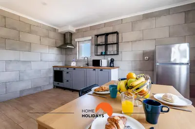 a kitchen with a table with food on it at #179 Monte das Churras 2 by Home Holidays in Albufeira