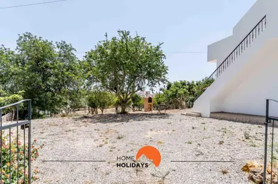 a view of the courtyard of a house with trees at #179 Monte das Churras 2 by Home Holidays in Albufeira
