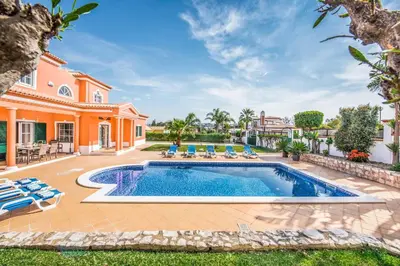 a swimming pool in the backyard of a house at Villa Luis in Galé