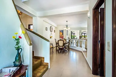 a hallway of a home with a dining room at Villa Toad Hall in Galé