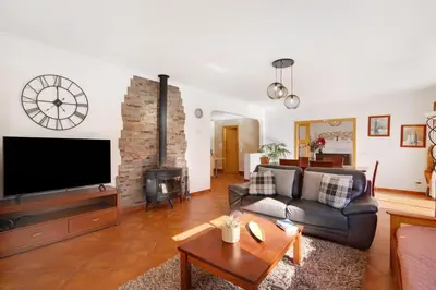 a living room with a couch and a fire place at Casa Palma in Paderne