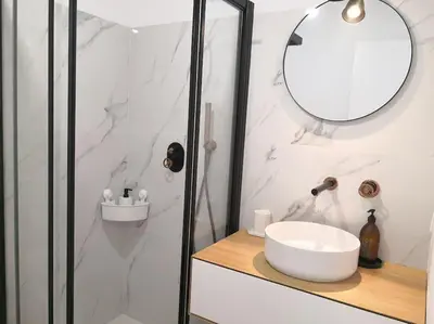 a white bathroom with a sink and a mirror at Airy 3br, AC, Garden, 2min Strip, 8min Oura Beach in Albufeira