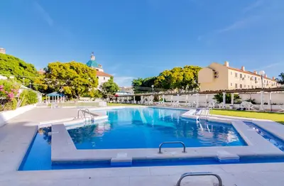 a large swimming pool in the middle of a building at AL - Vilamoura Algardia in Vilamoura