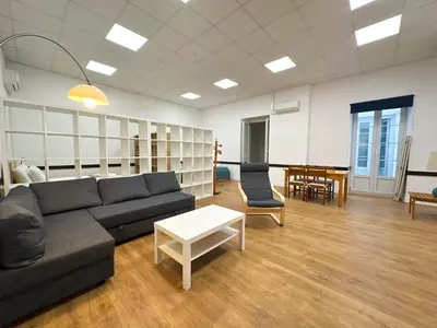 a living room with a couch and a table at Albergaria Formosa in Faro
