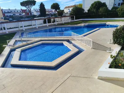 a large swimming pool on top of a building at Vilamoura Central 7 With Pool by Homing in Vilamoura