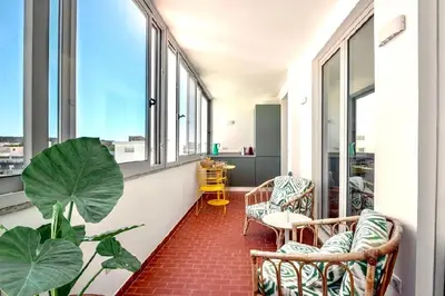 a kitchen with green cabinets and a sink at Loulé Old Town Apartment in Loulé