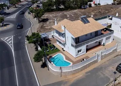 an aerial view of a house with a swimming pool at Villa Luz Vieira in Albufeira