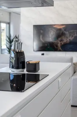 a kitchen counter with a knife set on top of it at The Albufeira Concierge - Prime Lounge Design in Albufeira