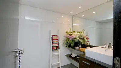 a bathroom with a sink and a mirror at Vila Mitri, Monte laguna-CleverDetails, 5 bedroom villa, sleeps 8 adults 2 children in Vilamoura