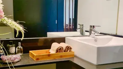 a bathroom with a sink and a mirror at Vila Mitri, Monte laguna-CleverDetails, 5 bedroom villa, sleeps 8 adults 2 children in Vilamoura
