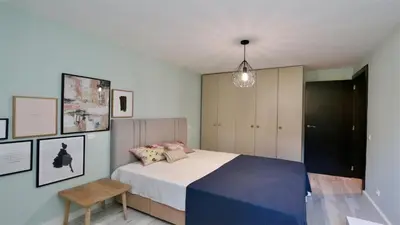 a bedroom with a bed and a pendant light at Vila Mitri, Monte laguna-CleverDetails, 5 bedroom villa, sleeps 8 adults 2 children in Vilamoura