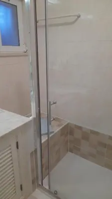 a shower with a glass door in a bathroom at Albufeira - Casa Balaia Resort in Albufeira