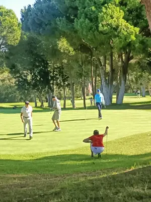 a group of people playing golf in a park at Albufeira - Casa Balaia Resort in Albufeira
