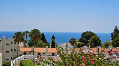 a view of a resort with the ocean in the background at Ocean View Beach Studio Old Town in Albufeira