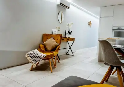 a living room with a desk and a chair at Sunlight Albufeira by Sunnyway in Albufeira