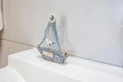 a blue bird cage sitting on top of a counter at Seaview Serenity with Pool & Garden in Quarteira