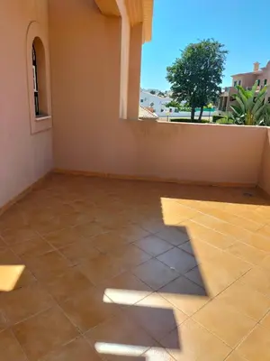 a room with a tile floor and a window at Villa V2 V in Olhos de Água