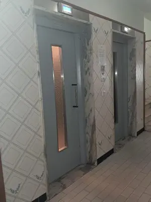 a bathroom with a walk in shower and a mirror at T1 MIRA PRAIA a in Quarteira