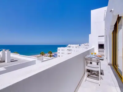 a balcony with a view of the ocean at AL - Atlântida Penthouse in Quarteira
