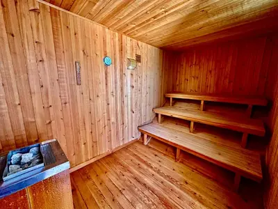 a wooden sauna with a bench in a room at SOLAR DO MONTE 1 in Albufeira