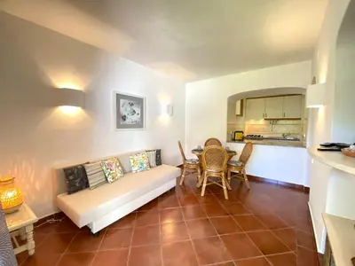 a white bathroom with a toilet and a sink at Albufeira Quinta da Balaia Garden by Homing in Albufeira