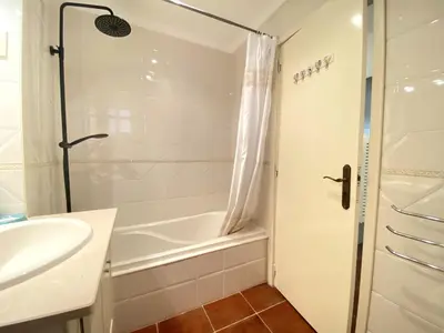 a bedroom with a bed with towels on it at Albufeira Quinta da Balaia Garden by Homing in Albufeira