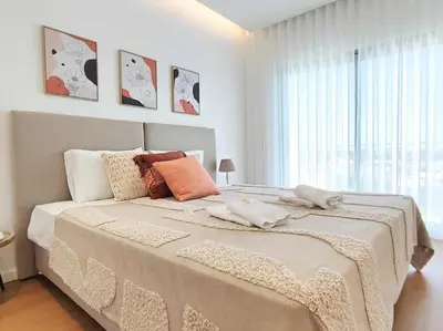 a bedroom with a large bed with a large window at Vistas Mar Villas D by Stay ici Algarve Holiday Rental in Albufeira