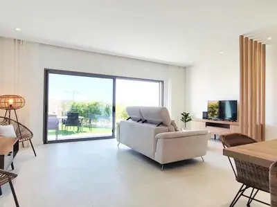 a living room with a couch and a table at Vistas Mar Villas D by Stay ici Algarve Holiday Rental in Albufeira