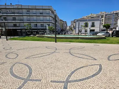 a drawing on a sidewalk in a city at The Singular - Downtown Studio in Faro