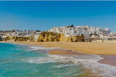 a view of a beach with white buildings at Votre refuge en bord de mer ! in Albufeira