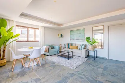 a living room with a couch and a table at Falesia Beach C in Albufeira