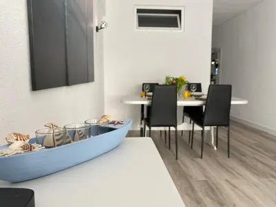 a blue boat sitting on a table in a room at Renovated Oasis Ocean View 1BD Wi-Fi Beach 3 min in Albufeira