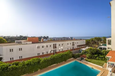 an aerial view of a building with a swimming pool at Renovated Oasis Ocean View 1BD Wi-Fi Beach 3 min in Albufeira