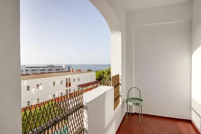 a balcony with a view of the ocean at Renovated Oasis Ocean View 1BD Wi-Fi Beach 3 min in Albufeira