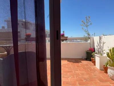 a sliding glass door with a view of a patio at Superstar terrace in Faro