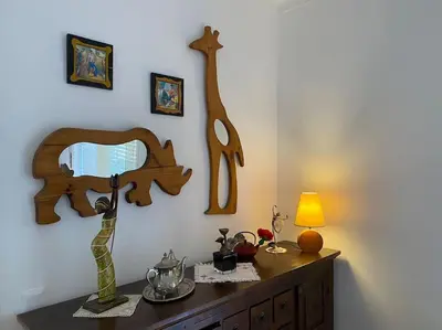 a room with a dresser with a lamp on it at Superstar terrace in Faro