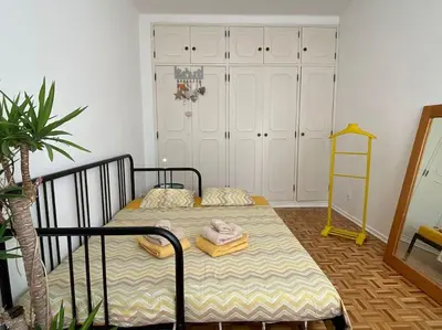 a bedroom with a bed with towels on it at Superstar terrace in Faro