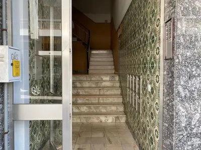 a stairway with stairs leading up to a building at Superstar terrace in Faro