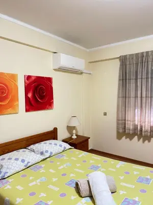 a bedroom with a bed and two paintings on the wall at CENTER HOUSE in Faro
