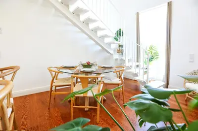 a dining room with a table and chairs at Ria Formosa Vista Duplex Charm in downtown Faro in Faro