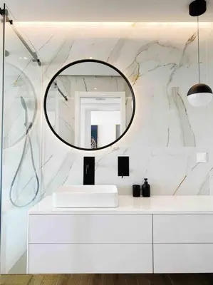 a bathroom with a white sink and a mirror at Front Sea Apartment Albufeira in Albufeira