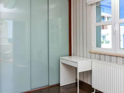 a white desk in a room with a window at Dunas Salgados Apartment by Stay ici Algarve Holiday Rental in Albufeira