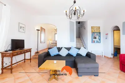 a living room with a couch and a table at #185 V3 Laranjeiras by Home Holidays in Albufeira