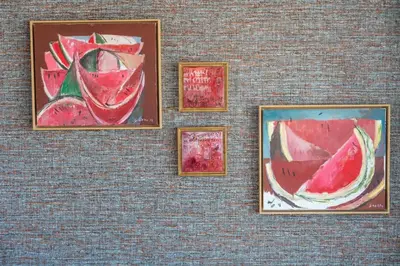 a group of paintings on a wall at Diamond Downtown Center in Faro