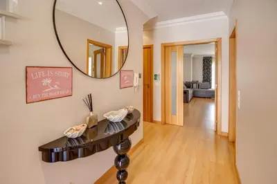 a mirror on a wall in a room with a hallway at Private Deluxe 3BD Villa Pool Wi-Fi AC BBQ in Albufeira