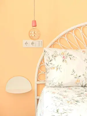 a bedroom with a white bed and a pink wall at Sunlight House in Faro