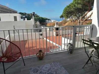 a balcony with a view of the ocean from a house at EMCA HOME Albufeira in Olhos de Água